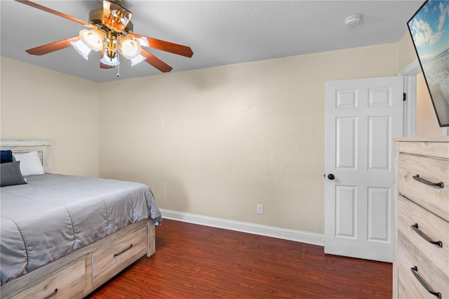 2110 W Farwell Dr, Tampa, FL 33603 - bedroom with dark wood-style floors, baseboards, and ceiling fan