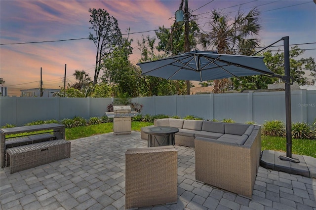 2110 W Farwell Dr, Tampa, FL 33603 - patio terrace at dusk with a patio, a fenced backyard, and outdoor lounge area