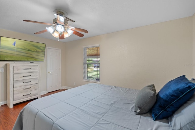 2110 W Farwell Dr, Tampa, FL 33603 - bedroom featuring wood finished floors, baseboards, and ceiling fan