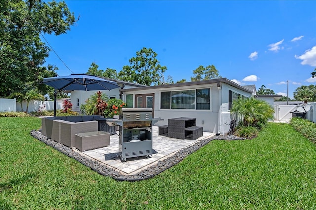 2110 W Farwell Dr, Tampa, FL 33603 - rear view of property featuring outdoor lounge area, a patio, and stucco siding