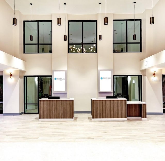 15695 Grove Resort Ave Unit 4438, Winter Garden, FL 34787 - unfurnished living room with a high ceiling and light wood-type flooring