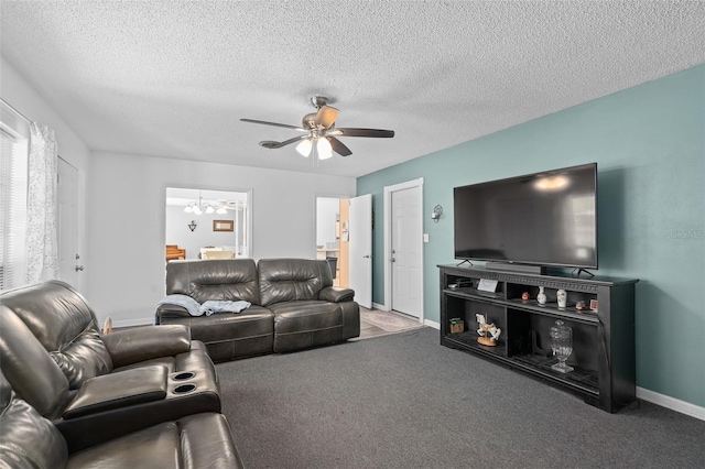 217 Spencer St, Orlando, FL 32839 - living room with a ceiling fan, carpet flooring, a chandelier, baseboards, and a textured ceiling