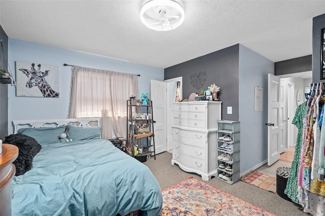 217 Spencer St, Orlando, FL 32839 - carpeted bedroom featuring a textured ceiling and baseboards