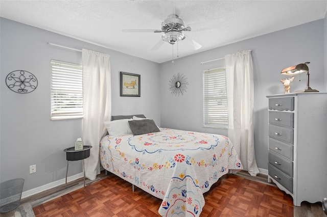 217 Spencer St, Orlando, FL 32839 - bedroom featuring baseboards, ceiling fan, and a textured ceiling