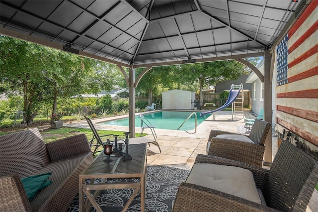 217 Spencer St, Orlando, FL 32839 - view of pool with a water slide and a patio