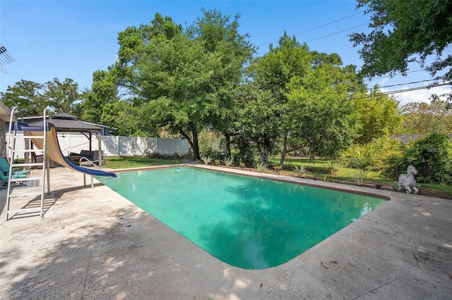 217 Spencer St, Orlando, FL 32839 - view of pool featuring a water slide, a patio area, a fenced backyard, and a gazebo