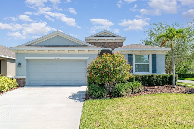 7308 Hermes Ct, Apollo Beach, FL 33572 - view of front of property with stone siding, stucco siding, and concrete driveway
