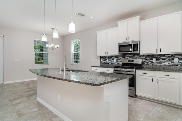 7308 Hermes Ct, Apollo Beach, FL 33572 - kitchen featuring stainless steel appliances, a sink, a center island with sink, tasteful backsplash, and recessed lighting