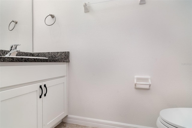 7308 Hermes Ct, Apollo Beach, FL 33572 - bathroom featuring vanity, toilet, and baseboards