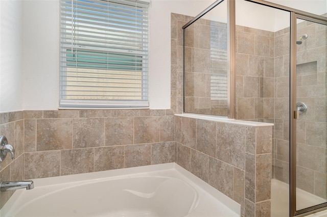 7308 Hermes Ct, Apollo Beach, FL 33572 - bathroom featuring a stall shower and a garden tub