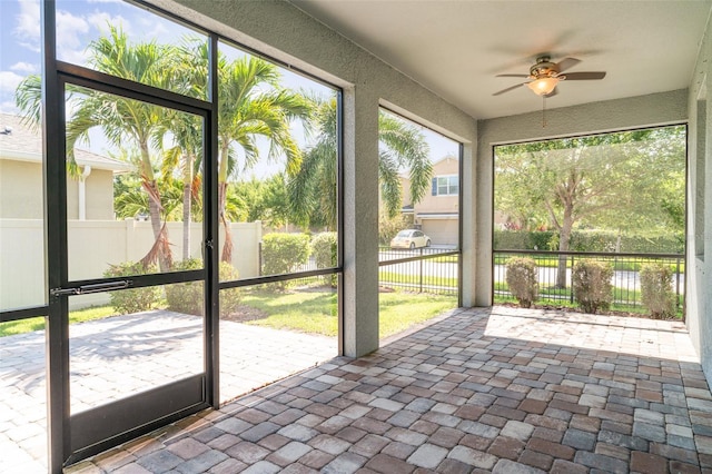 7308 Hermes Ct, Apollo Beach, FL 33572 - unfurnished sunroom with ceiling fan