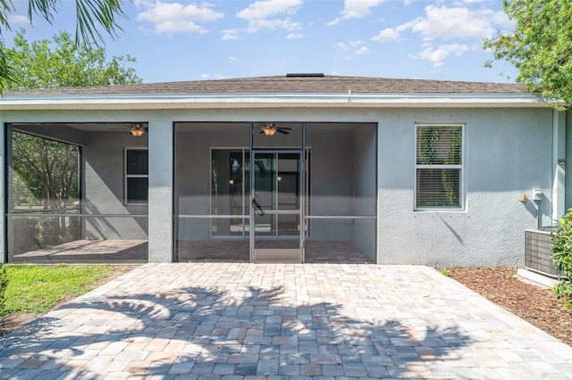 7308 Hermes Ct, Apollo Beach, FL 33572 - rear view of house with a patio, a ceiling fan, stucco siding, and a sunroom