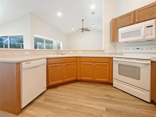 13210 Essman Ave, Port Charlotte, FL 33953 - kitchen with white appliances, lofted ceiling, a sink, light wood-type flooring, and ceiling fan