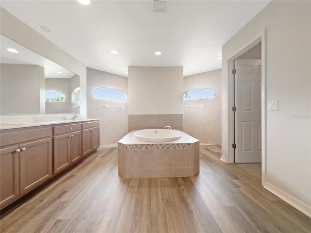 13210 Essman Ave, Port Charlotte, FL 33953 - full bathroom with wood finished floors, a garden tub, a walk in shower, and recessed lighting