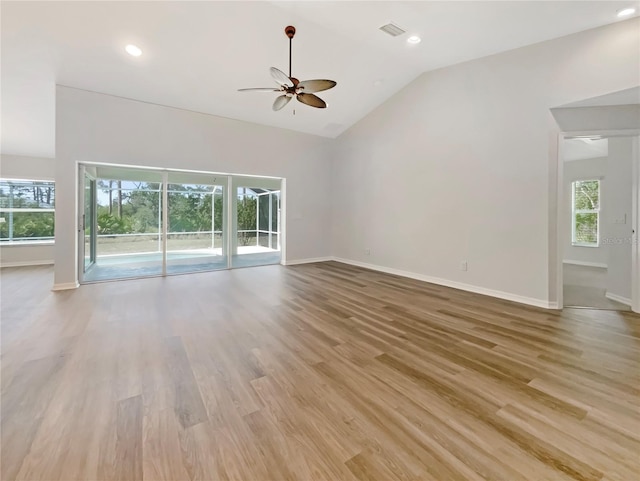 13210 Essman Ave, Port Charlotte, FL 33953 - unfurnished living room with a ceiling fan, lofted ceiling, baseboards, light wood-type flooring, and recessed lighting