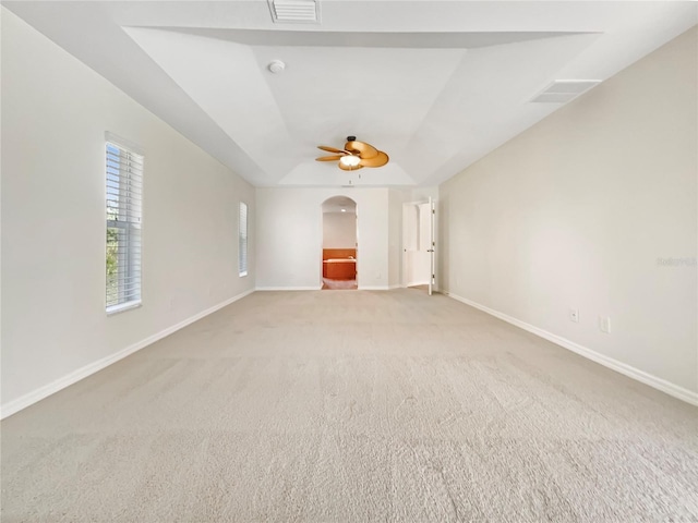 13210 Essman Ave, Port Charlotte, FL 33953 - empty room featuring arched walkways, light colored carpet, baseboards, and ceiling fan