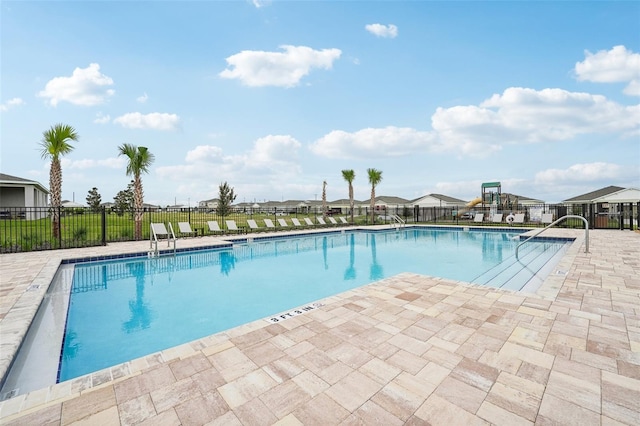 1323 Normandy Dr, Haines City, FL 33844 - community pool featuring a patio area