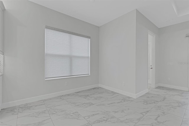 32740 Tree Of Life Ave, Wesley Chapel, FL 33543 - spare room with light marble finish floors and baseboards