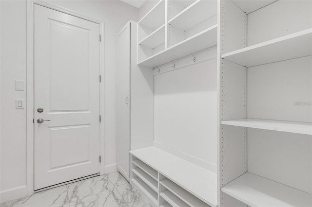 32740 Tree Of Life Ave, Wesley Chapel, FL 33543 - mudroom featuring light marble finish floors and baseboards