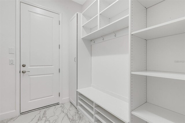 32740 Tree Of Life Ave, Wesley Chapel, FL 33543 - mudroom with light marble finish floors and baseboards
