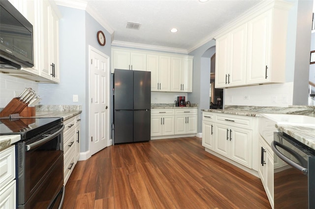 319 Morning View Dr, Winter Garden, FL 34787 - kitchen featuring black appliances, ornamental molding, dark wood-style floors, white cabinets, and arched walkways