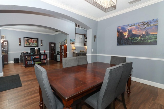 319 Morning View Dr, Winter Garden, FL 34787 - dining area with arched walkways, wood finished floors, and crown molding