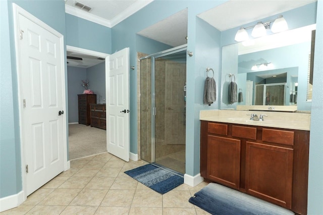 319 Morning View Dr, Winter Garden, FL 34787 - bathroom featuring crown molding, a stall shower, vanity, and tile patterned flooring