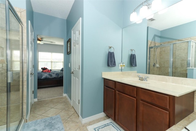319 Morning View Dr, Winter Garden, FL 34787 - ensuite bathroom with a stall shower, vanity, ceiling fan, and tile patterned flooring