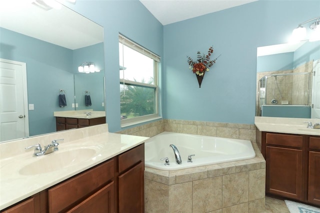 319 Morning View Dr, Winter Garden, FL 34787 - bathroom with two vanities, a garden tub, and a stall shower