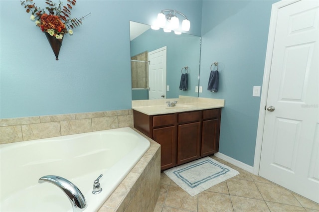 319 Morning View Dr, Winter Garden, FL 34787 - full bathroom featuring a garden tub, vanity, and tile patterned flooring