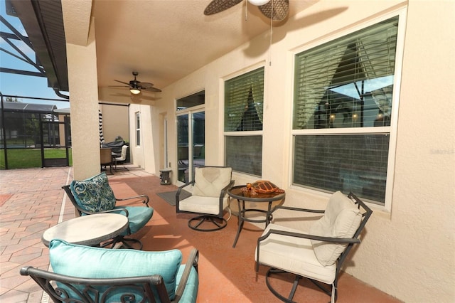 319 Morning View Dr, Winter Garden, FL 34787 - view of patio featuring a ceiling fan, glass enclosure, and a fire pit