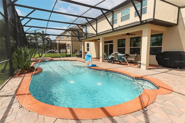 319 Morning View Dr, Winter Garden, FL 34787 - view of swimming pool with area for grilling, a patio, a pool with connected hot tub, a ceiling fan, and glass enclosure