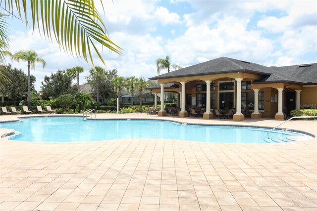 319 Morning View Dr, Winter Garden, FL 34787 - community pool featuring a patio area