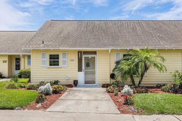 1146 Villa Ln Unit 101, Apopka, FL 32712 - view of front of property with a shingled roof