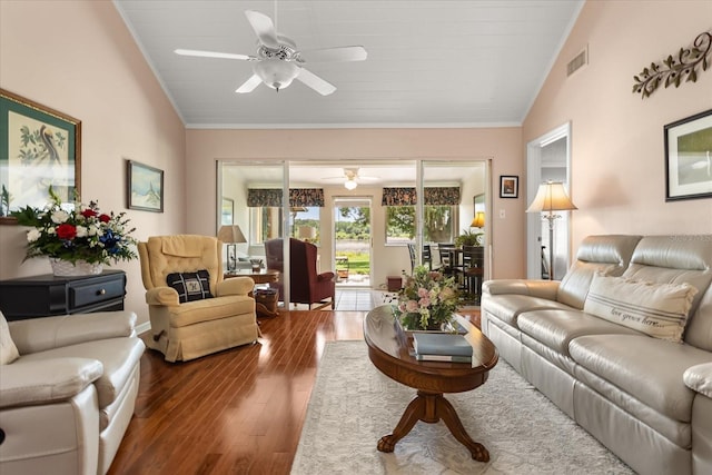 1146 Villa Ln Unit 101, Apopka, FL 32712 - living area featuring vaulted ceiling, wood finished floors, a ceiling fan, and crown molding