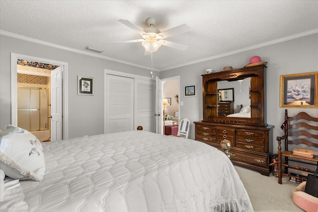 1146 Villa Ln Unit 101, Apopka, FL 32712 - carpeted bedroom with a closet, crown molding, a textured ceiling, ceiling fan, and ensuite bath