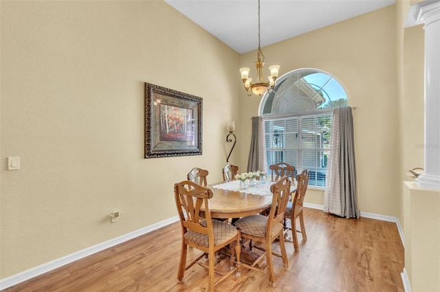 1017 Parkside Pointe Blvd, Apopka, FL 32712 - dining space featuring light wood-type flooring, baseboards, and a chandelier