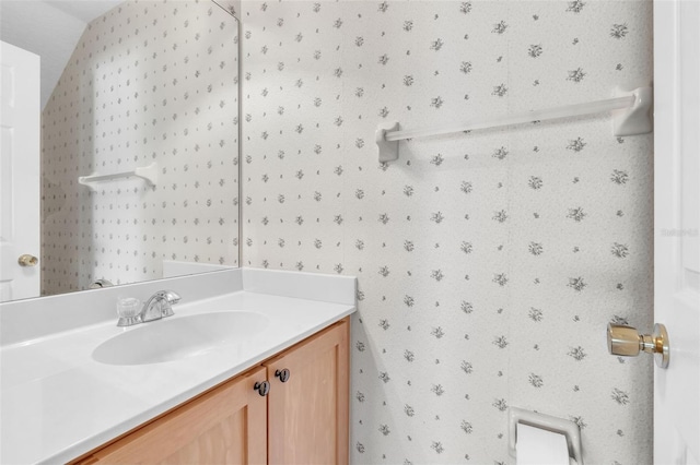 1017 Parkside Pointe Blvd, Apopka, FL 32712 - bathroom with vanity and wallpapered walls