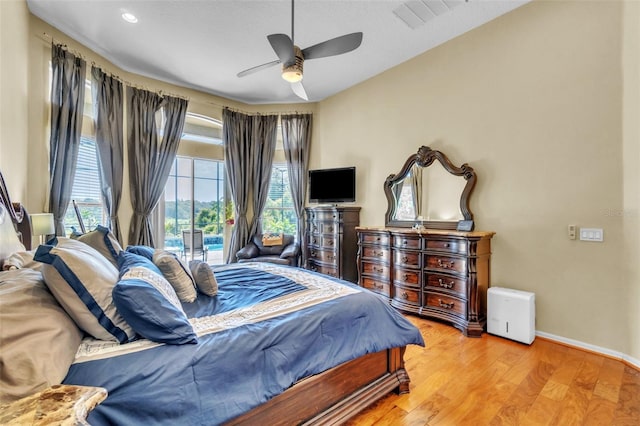 1017 Parkside Pointe Blvd, Apopka, FL 32712 - bedroom featuring wood finished floors, baseboards, and ceiling fan