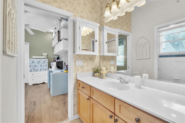 1017 Parkside Pointe Blvd, Apopka, FL 32712 - full bathroom with wallpapered walls and vanity