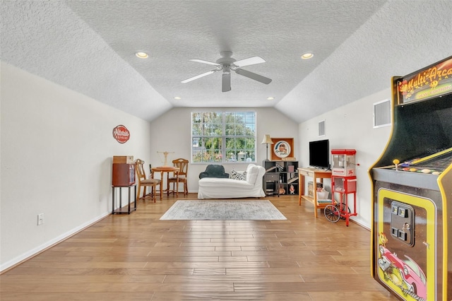 1017 Parkside Pointe Blvd, Apopka, FL 32712 - game room with wood finished floors, lofted ceiling, ceiling fan, a textured ceiling, and baseboards