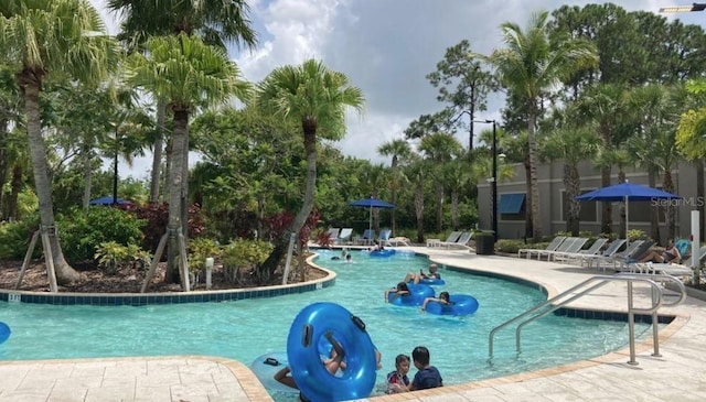 14501 Grove Resort Ave Unit 2129, Winter Garden, FL 34787 - community pool with a patio