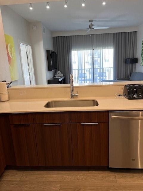 14501 Grove Resort Ave Unit 2129, Winter Garden, FL 34787 - kitchen featuring dishwasher, a sink, light countertops, modern cabinets, and ceiling fan