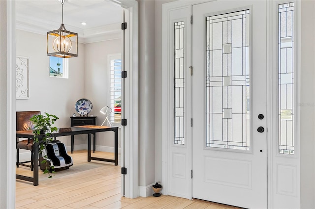4754 Manning Ct, Sarasota, FL 34240 - entryway featuring a chandelier, baseboards, light wood finished floors, and crown molding