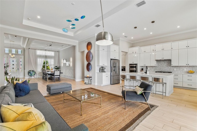 4754 Manning Ct, Sarasota, FL 34240 - living room featuring crown molding, light wood finished floors, and recessed lighting