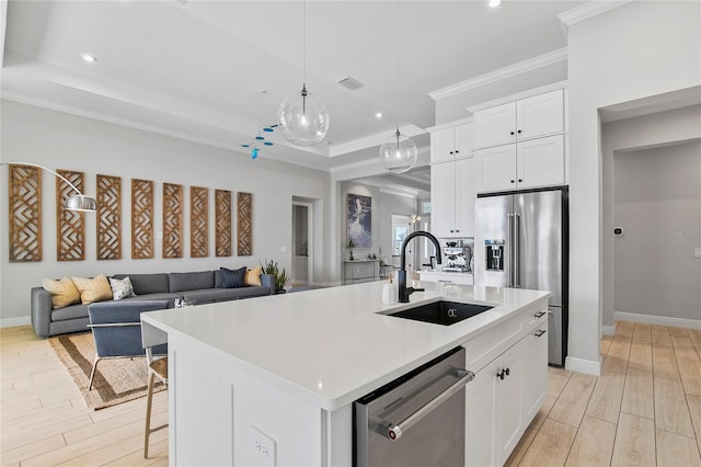 4754 Manning Ct, Sarasota, FL 34240 - kitchen with a sink, stainless steel appliances, ornamental molding, light wood-style floors, and recessed lighting