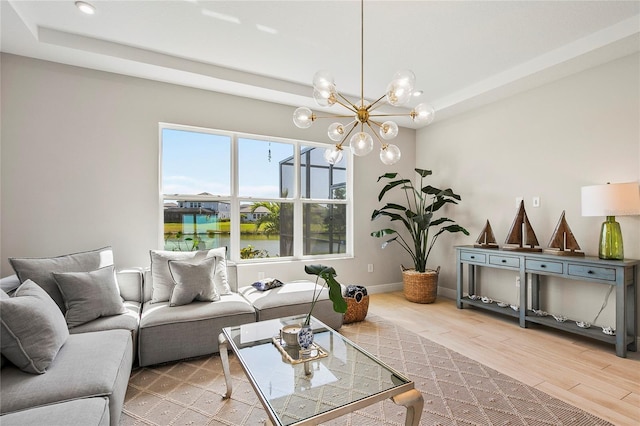 4754 Manning Ct, Sarasota, FL 34240 - living area with a chandelier, light wood finished floors, recessed lighting, a water view, and baseboards