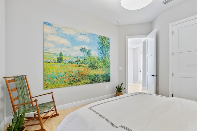 4754 Manning Ct, Sarasota, FL 34240 - bedroom with light wood finished floors and baseboards