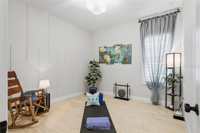 4754 Manning Ct, Sarasota, FL 34240 - exercise room featuring light wood-style flooring and baseboards