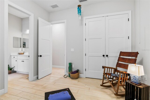 4754 Manning Ct, Sarasota, FL 34240 - sitting room with light wood-style flooring and baseboards
